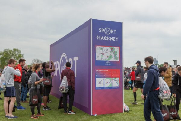 Large super-graphic wayfinding and photo backdrop at the Hackney Half Marathon