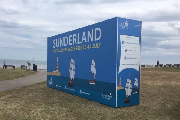 Large super-graphic wayfinding and photo backdrop at the Tall Ships Race event