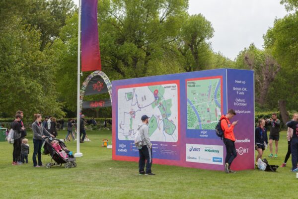 Large super-graphic wayfinding and photo backdrop at the Hackney Half Marathon