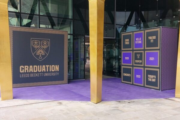Small super-graphic photo backdrop at Leeds Beckett's graduation ceremony