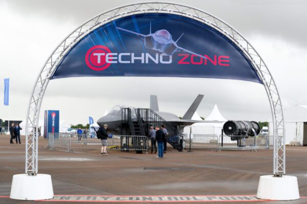 Truss arch on concrete bases at airshow